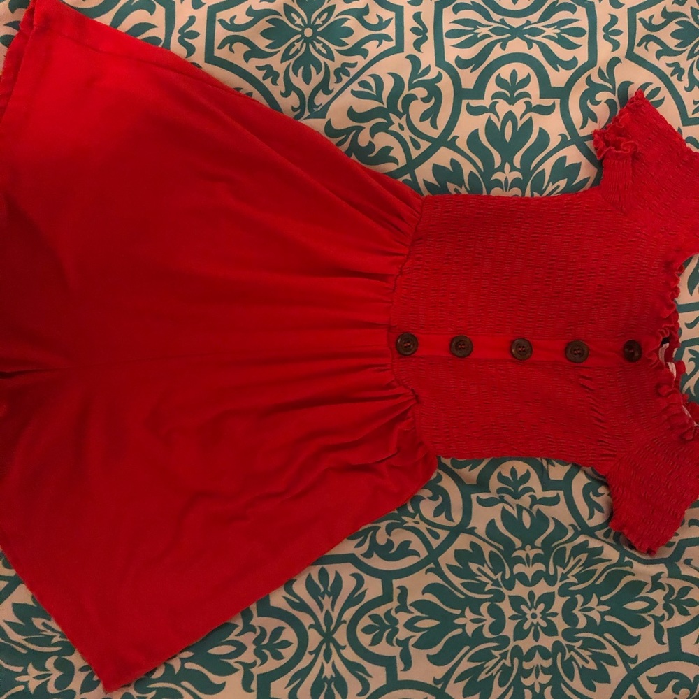 Red romper.
